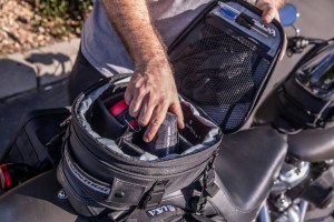 Photo showing man reaching into tail bag with dividers installed